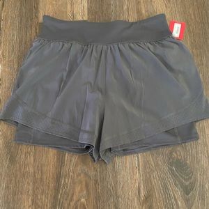 NWT Spanx Get Moving Shorts. Have bike shorts underneath. Grey. Size Large.